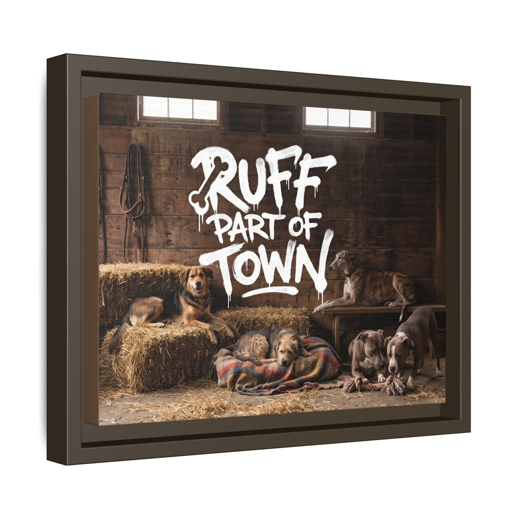 Ruff Part of Town framed canvas art featuring a group of dogs resting in a barn with hay bales and a colorful blanket.
