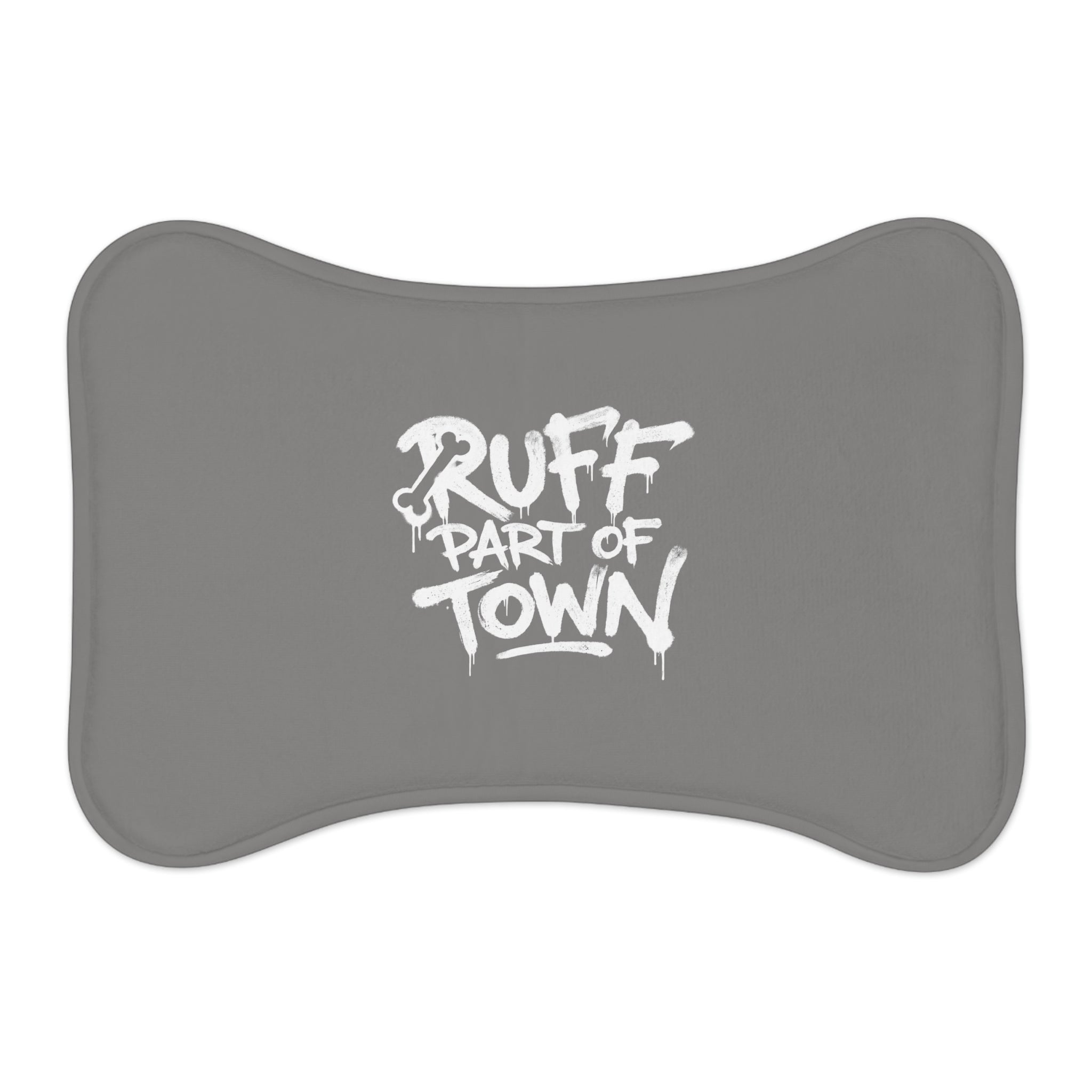 Ruff Part of Town grey bone-shaped dog feeding mat with white graffiti print. Non-slip polyester and memory foam.