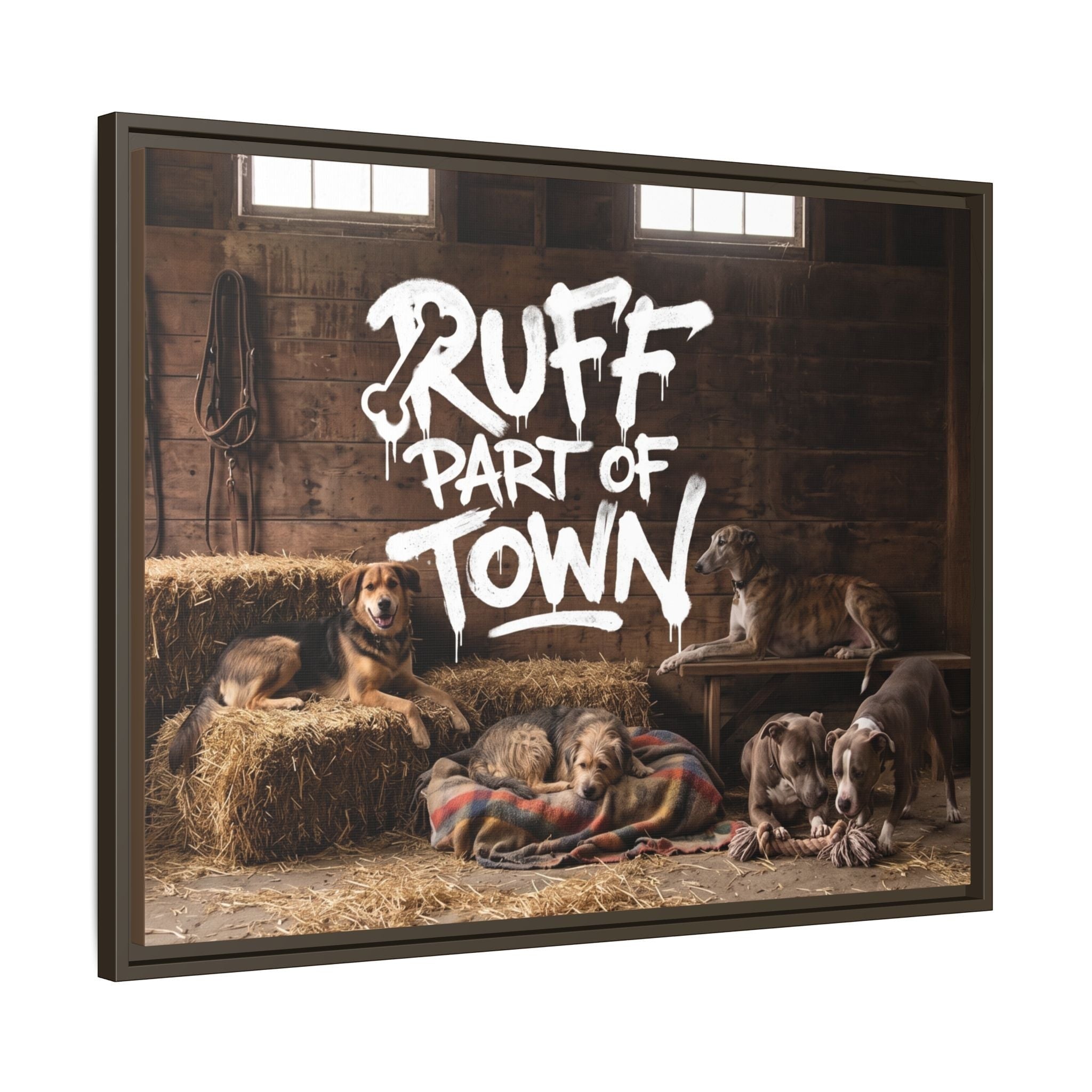 Ruff Part of Town framed canvas art featuring five dogs relaxing in a rustic barn setting with hay bales and a plaid blanket.