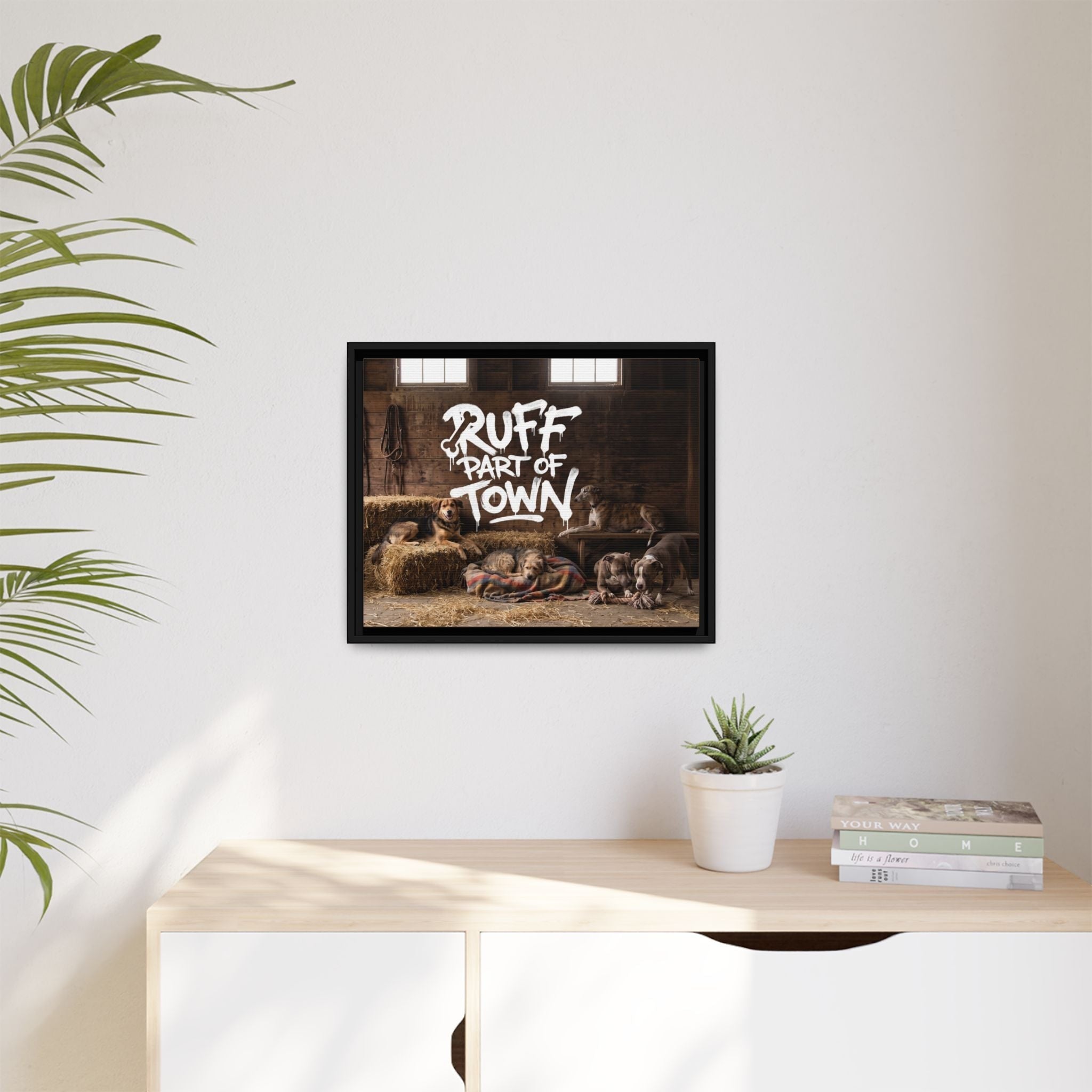 Ruff Part of Town framed canvas art featuring sleepy dogs on hay bales in a barn with hand-lettered text.