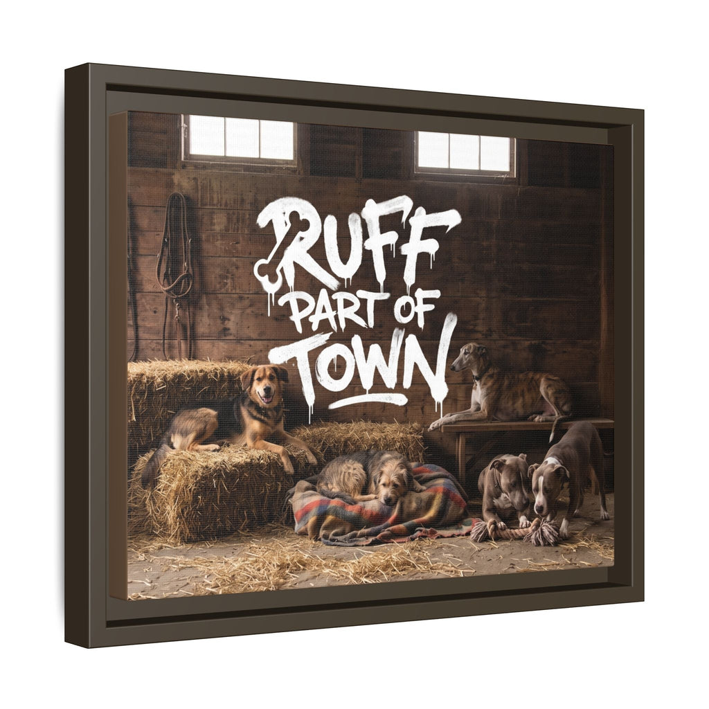 Ruff Part of Town framed canvas wall art featuring a group of dogs resting in a barn with hay bales and a rustic wooden background.