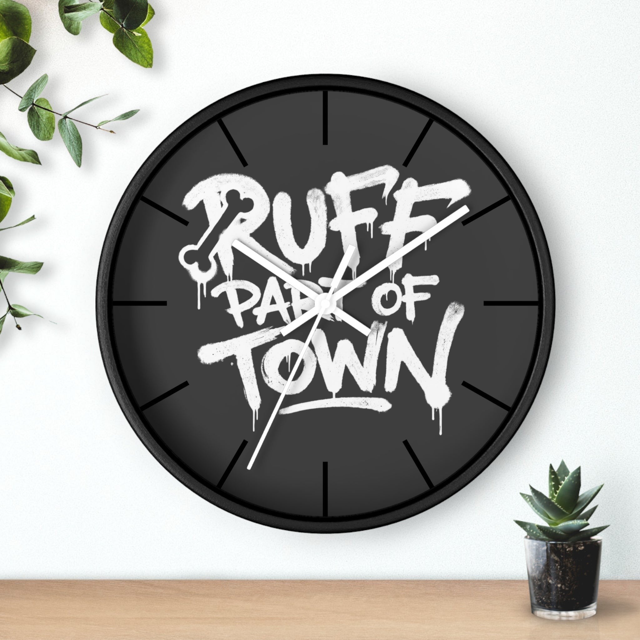 Ruff Part of Town black wooden wall clock with white graffiti-style lettering and a bone graphic. Features a plexiglass face and silent mechanism.