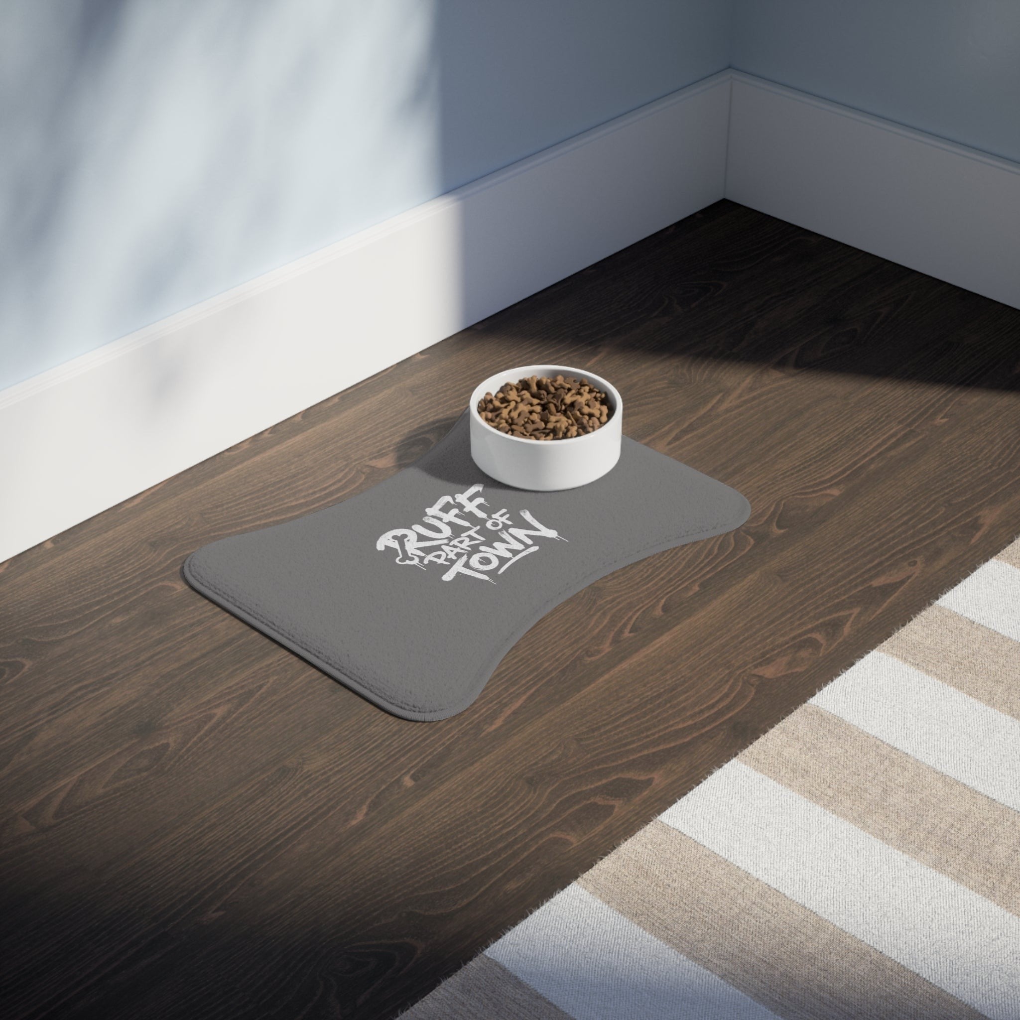 Ruff Part of Town grey polyester pet feeding mat with white graffiti print and anti-slip backing.