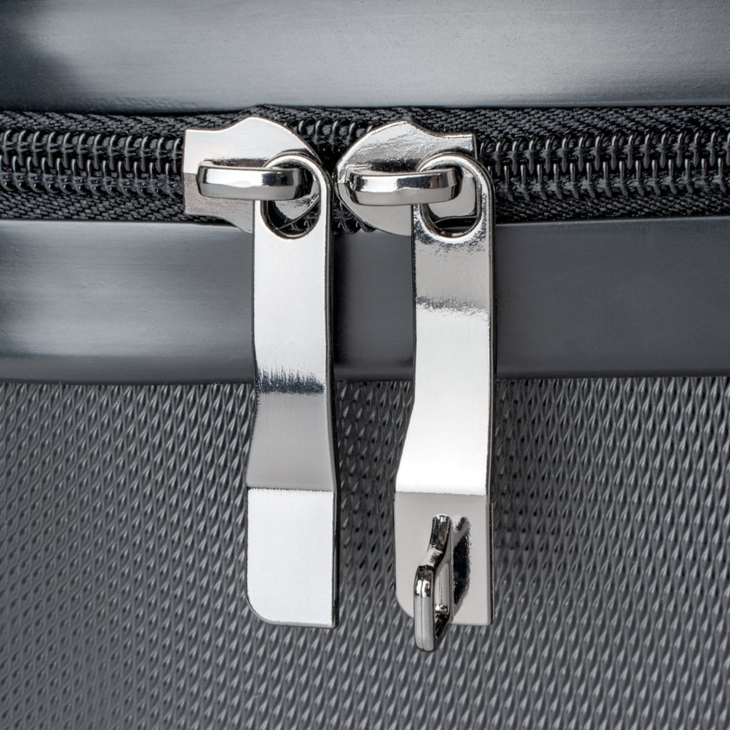 Ruff Part of Town grey hard-shell suitcase zippers with built-in lock detail.