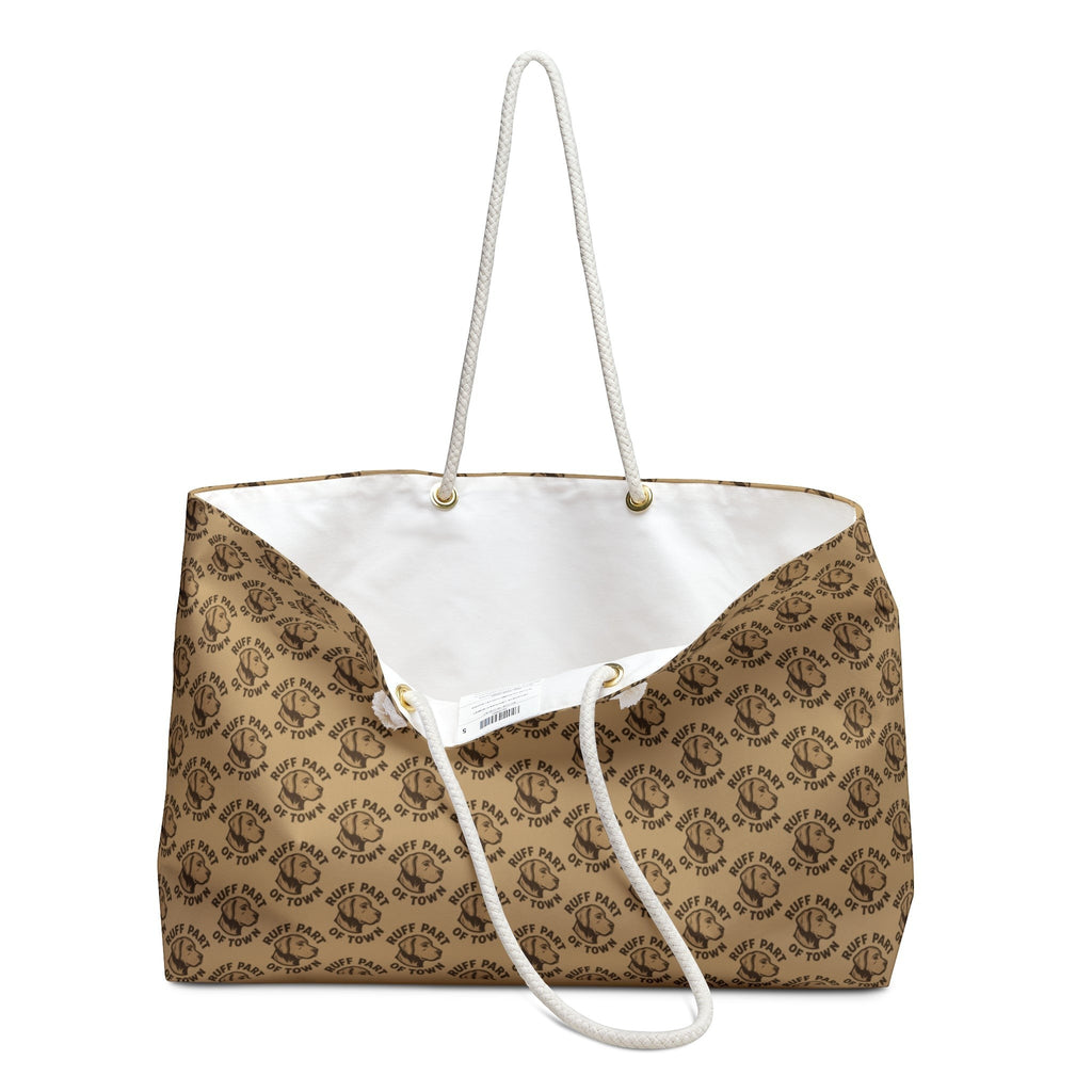 Ruff Part of Town logo pattern weekender bag with cream rope handles and gold-tone grommets. Durable spun polyester exterior.