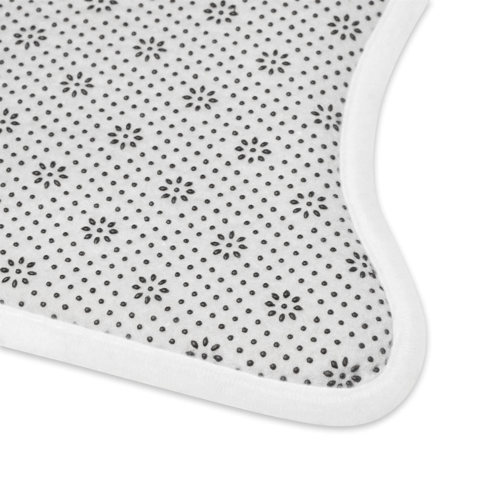 Ruff Part of Town pet feeding mat with anti-slip backing and plush polyester surface. White with black floral pattern.