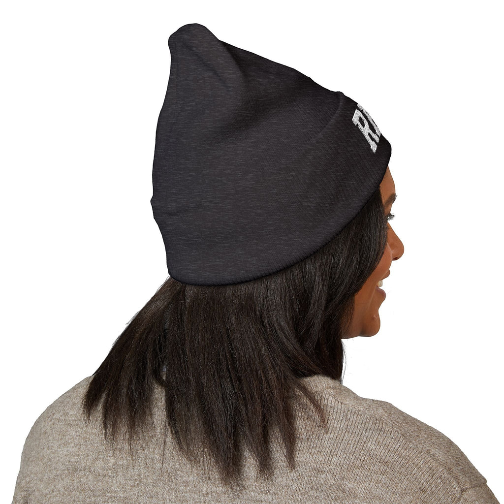 Ruff Part of Town black cuffed acrylic beanie with embroidered RPT logo and paw accent, worn by a woman.